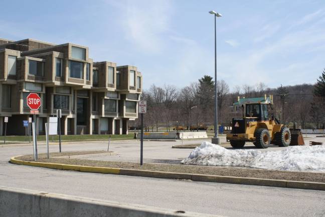Work begins on government center A construction vehicle fronts the Orange County Government Center, which is slated for demolition. Photo by Nathan Mayberg.