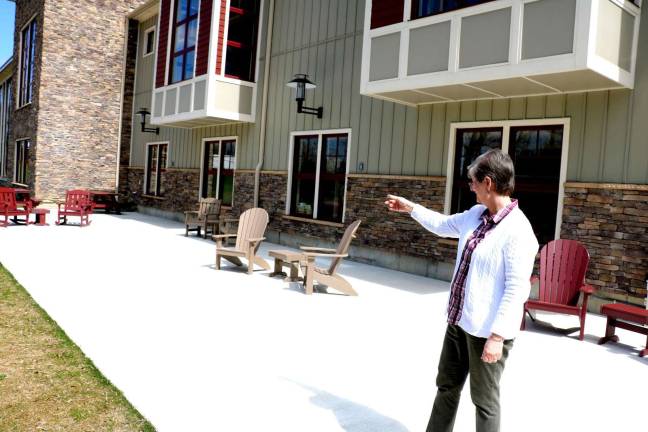 Library dedicates and celebrates new performance area on May 6 Photos by Roger Gavan Kathleen Georgalas, assistant to the director at Albert Wisner Public Library, points to the recently added River Birch Reading and Performance Patio.
