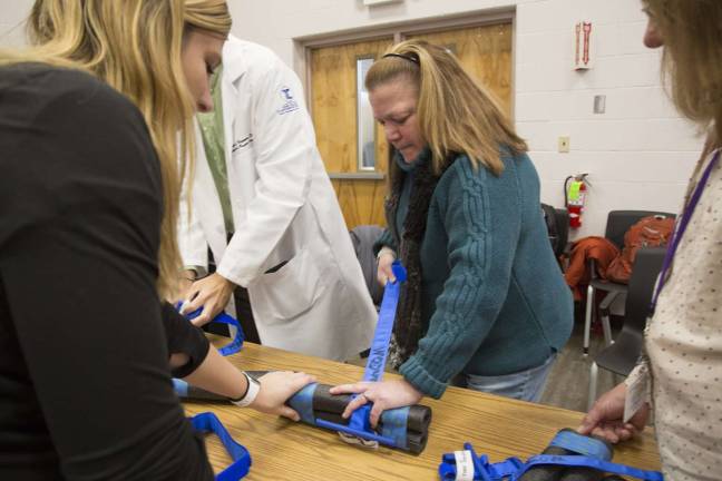 Warwick Valley teachers, staff get life-saving trauma training Park Avenue Elementary School Nurse Janet VanDuzer secures a tourniquet during Stop the Bleed, Save a Life training.