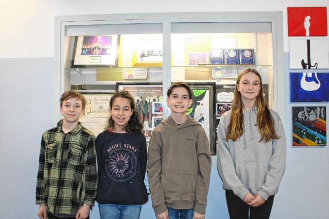 L-R: Riley Maesano and Linda Higgins (elementary chorus), and Tyler Fleury and Caroline Maher (junior high chorus).