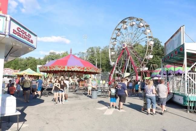 Record crowds enjoyed clear blue skies and summer weather at last sumer’s Warwick Fire Department’s annual carnival in Veterans’ Memorial Park. This year’s carnival has been cancelled because of the coronavirus pandemic. File photo by Roger Gavan.