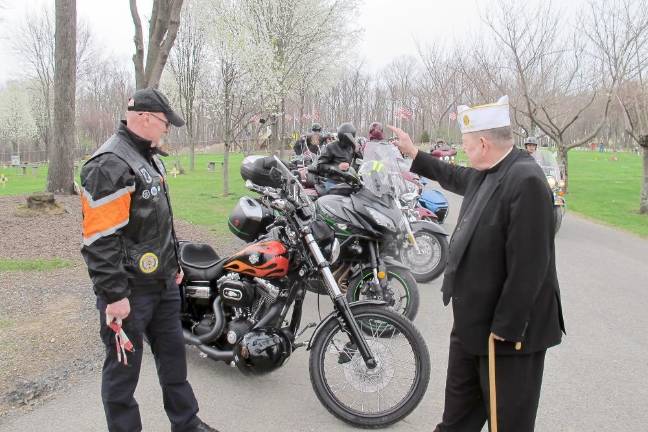 The blessing was performed by Chaplain Rev. Robert J. Sweeney, right.