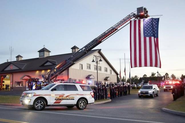 Members of the Pine Island Fire Department paid their last respects on Sunday afternoon, Nov 29, to firefighter Jimmy Black, who passed away on Nov. 24 at the age of 50. His obituary, which appears on Page XX, included this passage: “Jimmy was an active member of the Pine Island Volunteer Fire Department, Pulaski Company, for 16 years. He was devoted to his duty and to his brothers in the company. His faithful service embodied his commitment to helping others in his community.” At the wake, held at the Pine Island Firehouse, an American flag was hung over the entrance to the firehouse as firefighters lined up to salute the passing hearse escorted by Pine Island Fire Department personnel. Photos by Robert G. Breese.