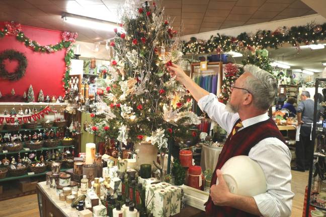 Warwick businesses enjoy successful holiday season Mayor Michael Newhard, who is also the owner of Newhard’s – The Home Source gift shop on Main Street, decorated this Christmas tree with roses. Children voted the rose as the official flower of the village.