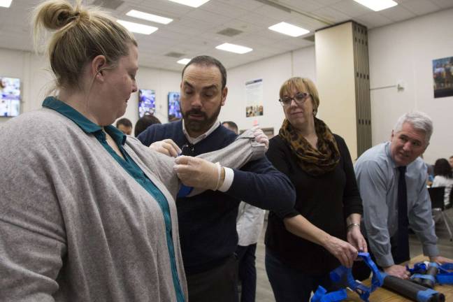 Warwick Valley teachers, staff get life-saving trauma training Warwick Valley School District Superintendent Dr. David Leach, second from left, applies a tourniquet to Meghan McGourty, the district's Director of Student Support Services.