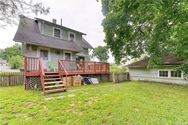 Charm and village convenience with quiet patio over fenced yard Charm and village convenience with quiet patio over fenced yard