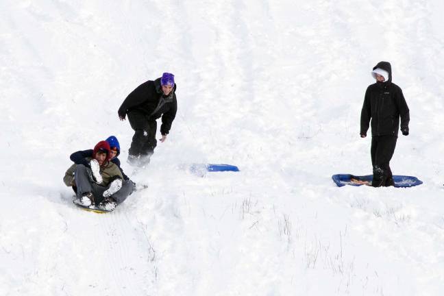 (S)no problem Photo by Robert G. Breese Climbing to the top of the huge hill on the Raynor Farm off Route 94 in Warwick is not easy especially when wearing winter gear and carrying a sled but Warwick friends Brad Stogner, John Kunzweiler, Thomas Wightman and Trevor Pinkham said the hard climb is worth the snowy ride to the bottom even if it includes a wipe out before you get there.