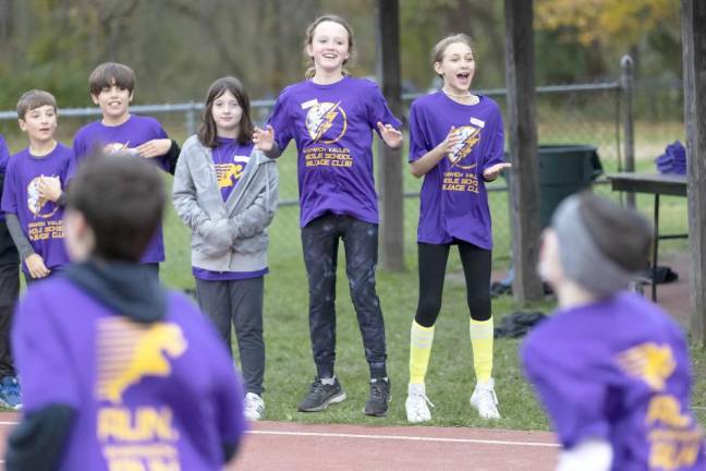 Sixth graders cheer fifth graders.