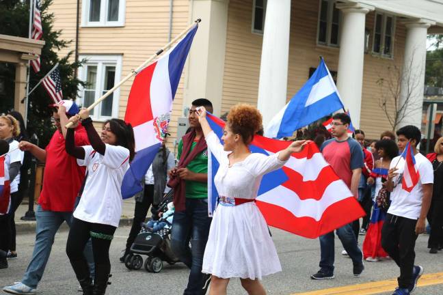 Warwick celebrates seventh annual Hispanic Heritage Day with a parade and ceremonies On Sunday afternoon, September 23, a colorful assembly of members of the Spanish Ministry of the Warwick Reformed Church formed a line of march from the church down Main Street, in the Village of Warwick, to the Railroad Green.