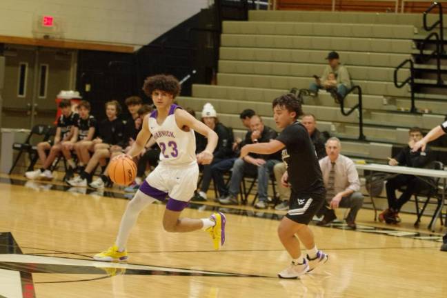 Warwick's Jaedyn Rodriguez handles the ball while covered by Wallkill Valley's Dylan Klackowski.