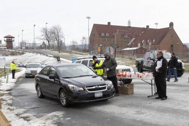 State, county and local Warwick officials handed out free covid test kits to Orange County, NY, residents at Wickham Woodlands Park on Friday.