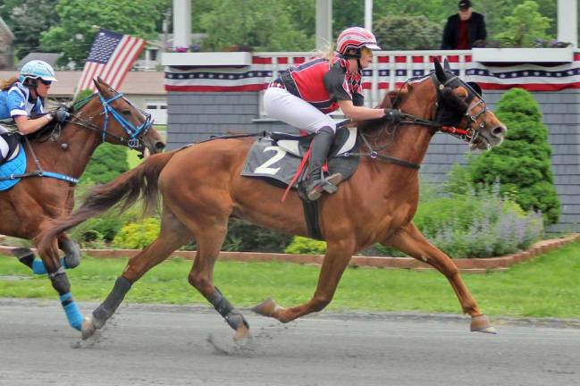 Historic Track season picks up the pace Sasha Moczulski, owner, rider and trainer of Hyway Marcus, wooed the crowd with a wire to wire win in 2:14.3. (Photo by Geri Schwarz)