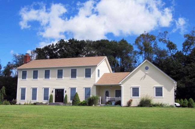 This elegant and well-appointed Colonial offers four bedrooms, scenic views and wooded privacy This elegant and well-appointed Colonial offers four bedrooms, scenic views and wooded privacy