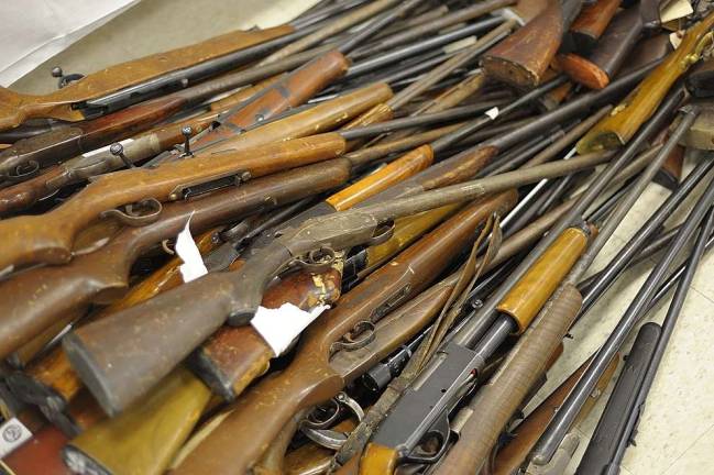 Diana's buyback nets 342 guns Many of the long guns exchanged were old and well-worn. (Photo by Joshua Rosenau)