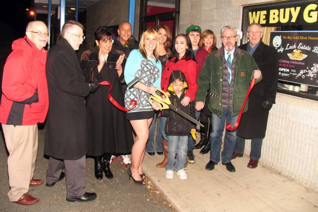 Grand openings Photo by Roger Gavan ady Luck Estate Buyers celebrates grand opening: Pictured in front from left to right are: Chamber Secretary Doug Stage, Town of Warwick Supervisor Michael Sweeton, Chamber First Vice President Sherry Bukovcan, owner Barbara Sklar, her daughter Isabella Sklar, 17, and son Andrew Gamble, 6, Mayor Michael Newhard and Chamber Executive Director Michael Johndrow.