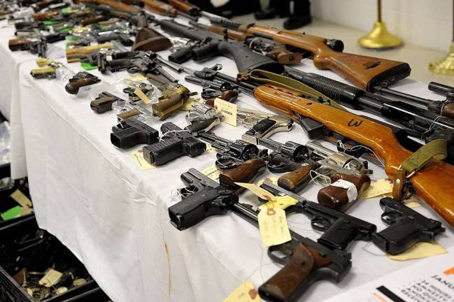 Diana's buyback nets 342 guns Handguns and assault-style weapons sit tagged on a table at the conclusion of Orange County's third gun buyback program, "Save a Life" on March 20. (Photo by Joshua Rosenau)