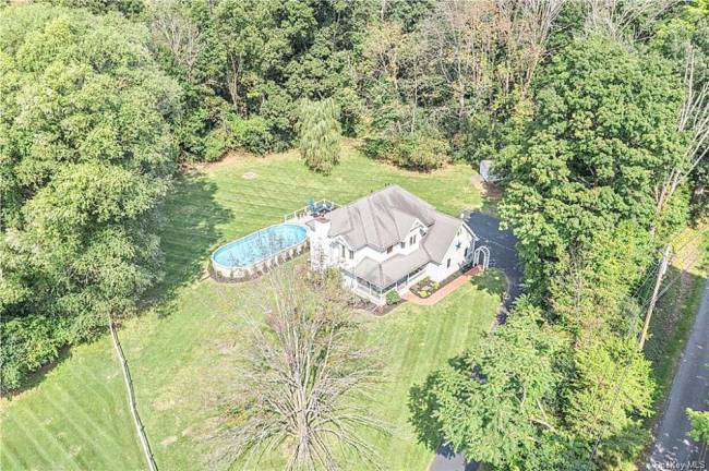 Three levels with lovely details and new custom features on 1.4 country acres with pool Three levels with lovely details and new custom features on 1.4 country acres with pool