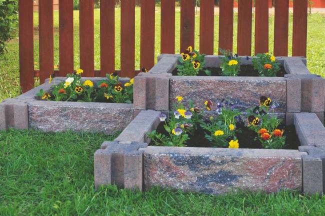 Elevate your gardening success Courtesy of Infinity Lawn and Garden Incorporating raised flower beds using stone planters can beautify the landscape without taking a lot of time or effort.