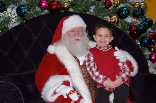 Vote for the best holiday photo Submitted by: Michael Barbella of West Milford, N.J. "Nicholas Barbella, 6, visits with jolly old St. Nicholas to discuss his 2013 Christmas wish list. Guess which list he's on?"