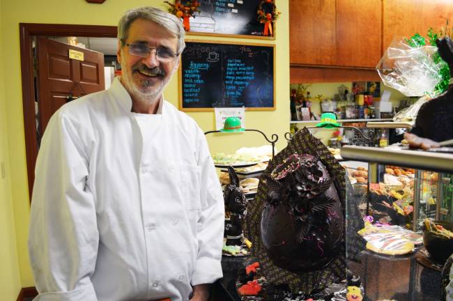 Jean-Claude’s host Easter egg raffle to benefit food pantry Photo provided by Inez Freund Executive Pastry Chef Jean-Claude Sanchez is pictured here with the handmade Easter egg his bakery will raffle on March 29 to benefit the Warwick Ecumenical Food Pantry.