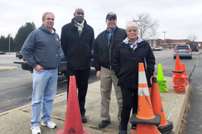 Ford’s innovative suits aim to put the brakes on impaired driving Provided photos From left: Leo Kaytes Jr. of Leo Kaytes Ford, Warwick Valley High School Principal Dr. Larry Washington, and Rick Braun and Leslie Colkin of Leo Kaytes Ford before the test drive in the parking lot of Warwick Valley High School.