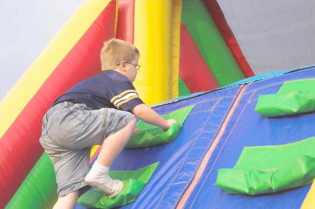 Castle to replace roller rink with inflatable obstacle course A boy does some climbing in an inflatable park. The Castle will have 12 activity areas, including a Ninja Wall for climbing.