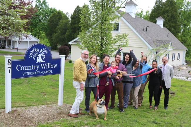 Exotic animals welcome Photo by Roger Gavan On Friday, May 17, Village of Warwick Mayor Michael Newhard (left) and members of the Warwick Valley Chamber of Commerce joined Dr. Sarah Marpet and her husband, Dr. Brian Civatte (center), their daughter Everleigh, 1, and a new patient, “Buddy,” an English Bulldog, to celebrate the official grand opening of their Country Willow Veterinary Hospital.