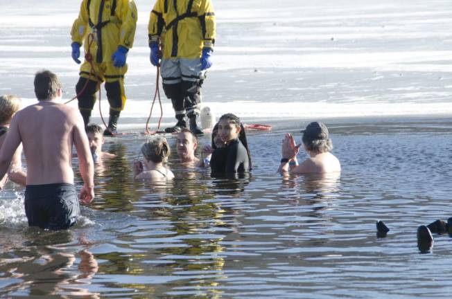 Thousands frolicked, some swam, at wintery carnival