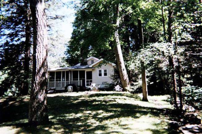 This wonderful property includes a pond, woods, waterfall, stream and three homes This wonderful property includes a pond, woods, waterfall, stream and three homes