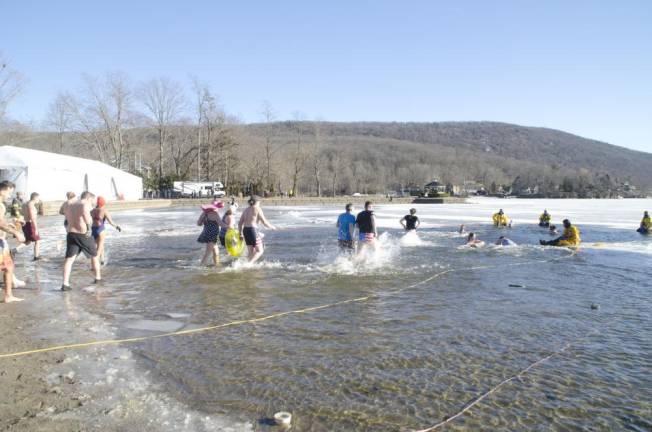 Thousands frolicked, some swam, at wintery carnival