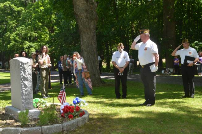 Departed veterans honored Members of the VFW salute at the memorial.