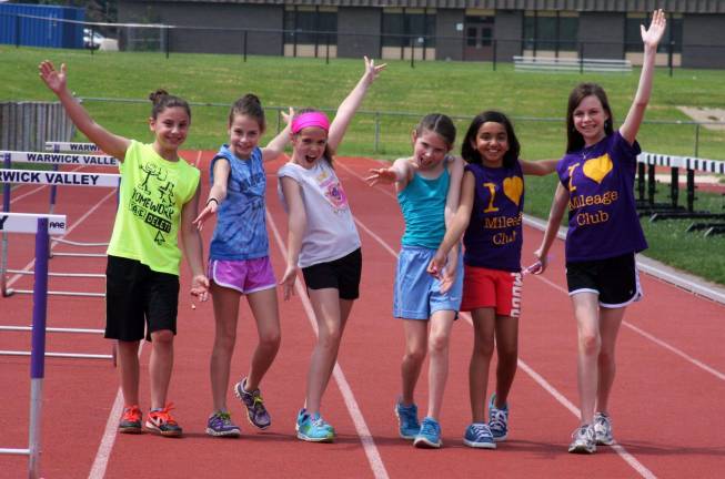 1,308 laps, 327 miles, 66 Middle School runners Some members of the Middle School Mileage Club strike a pose.