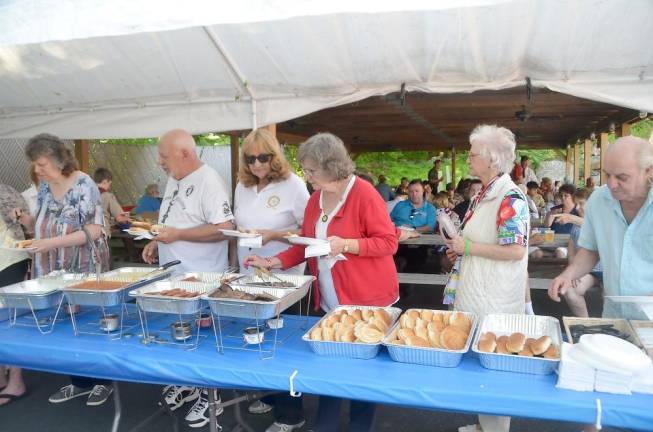 The crowd gathered for a barbeque after the Memorial Service.