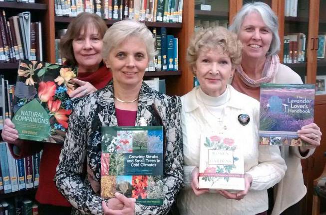 The Warwick Valley Gardeners recently made donations of new gardening books to all three Town of Warwick libraries. Shown here at the Warwick's Albert Wisner Library are Cathy Garofalo, Marcela Gross, WVG President Gert Galligan and Warwick Library Director Rosemary Cooper.