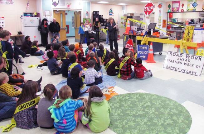 How do you spell help? DPW Provided photograph The Village of Warwickís Department of Public Works provided signs, construction horses, orange cones and other equipments to help illustrate the theme of this yearís Parents as Reading Partners program at Park Elementary Elementary School: Reading builds character.