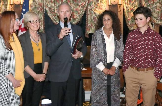 Master Doug Cook accepted the award for Outstanding Community Service on behalf of the members of the Youth Leadership Team of the Chosun Taekwondo Academy.