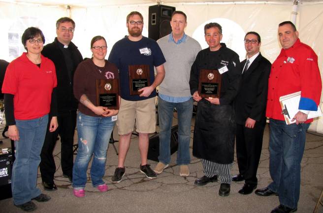 St. Stephen’s ninth annual Taste of the Town a record success The first-place winner for Fine Dining was the Breezy Point Inn in Greenwood Lake. Halliganís, in the Village of Warwick, took first place in comfort food and Eat Sweet Bake Shoppe, also in Warwick Village, won first place for Dessert. From left, Event Chair Mary Juliano, Father Michael McLoughlin, pastor of the Church of St. Stephen, the First Martyr, Eat Sweet co-owner Melissa Shultz,Halligan's Chef Rob Gallo, Breezy Point Chef Chris Colin, Poor Bobby's Manager Bob Ciardullo and Chef/owner Bobby Lerg.