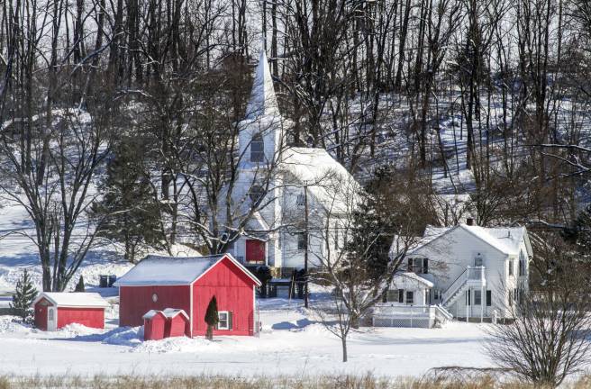 First major snow storm of 2013 Photo by Robert G. Breese A Pine Island classic with the red gift shop at Scheurmann's Farm and St. Peter's Lutheran Church in the background after a fresh snow has fallen.