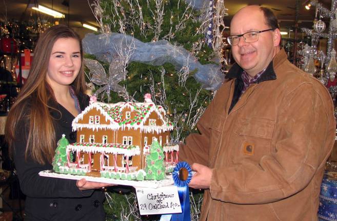 How sweet it is The winner of the family division was þÄúChristmas at 29 Oakland Avenue,þÄù by Chris DeHaan, a partner in the Middletown firm of DeGraw & DeHaan Architects, and his daughter Bridget, a senior at Warwick Valley High School.