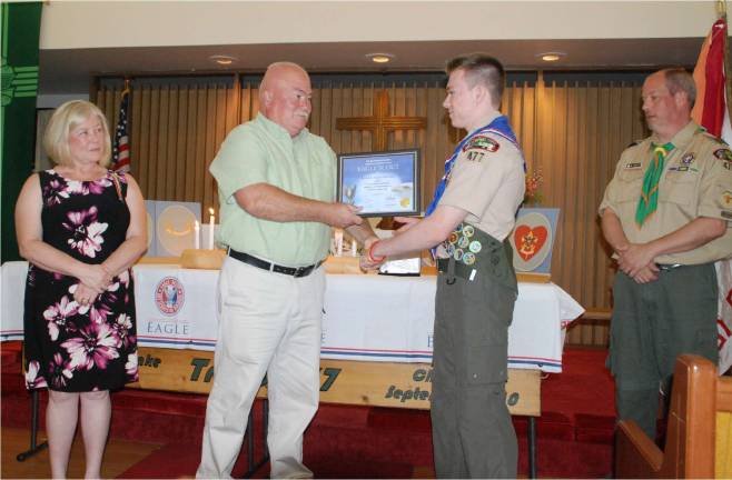 Hallinan earns Eagle Scout designation Photo provided Presentation of Eagle Certificate to Brendan Hallinan by his parents Vincent and Colleen Hallinan and Scoutmaster Jason Fox on right.