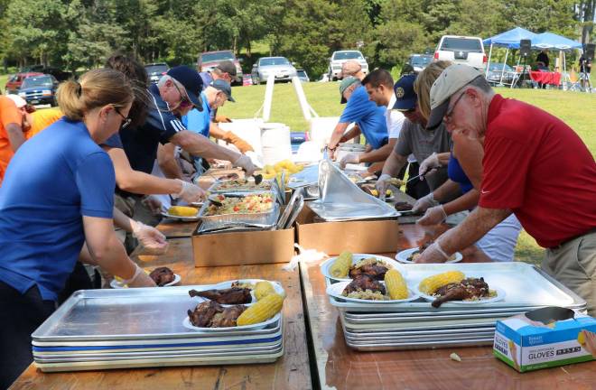 Great food, music and company Preparing to serve the feast.