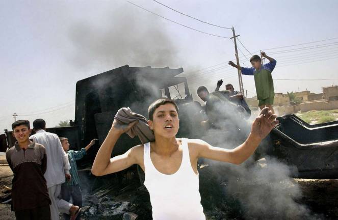 Master class: Telling stories, camera in hand "Iraq, 2003" by Kael Alford.