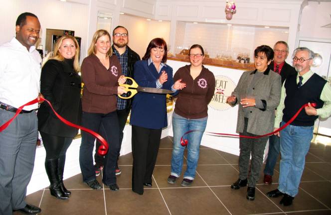 How sweet it is Photo by Roger Gavan Public officials and members of the Warwick Valley Chamber of Commerce join Abigail Stever and Melissa Schultz and their guests for the official grand opening of the new location of Eat Sweet Bakery. Front from left, Cedric Glasper, president of the Warwick Valley Chamber of Commerce; Interior Designer Caitlin Burck; Abigail Stever and her husband, Travis; Assemblywoman Annie Rabbitt; Melissa Schultz; Chamber Vice President Sherry Bukovcan; Executive Director Michael Johndrow; and Mayor Michael Newhard.