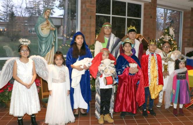 The children pose on the altar.