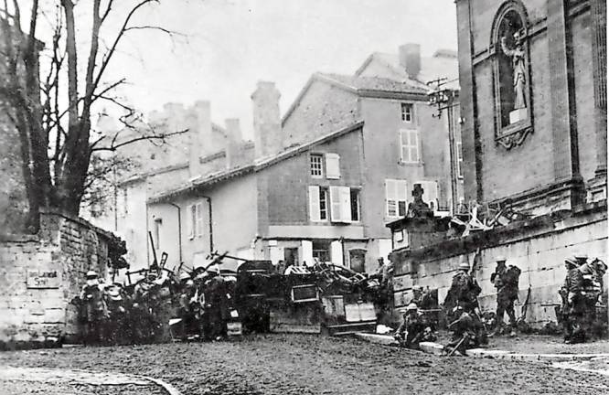 The history of Veterans Day Soldiers of the 353rd Infantry near a church at Stenay, Meuse, in France, wait for the end of hostilities.