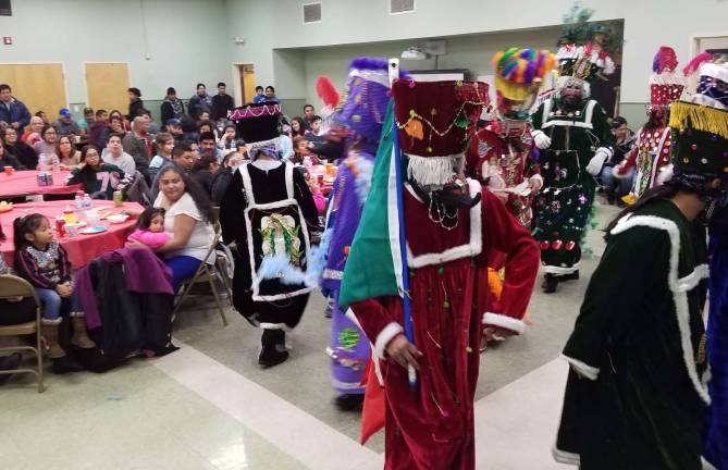 Spanish and English Mass at St. Stephen's honors Our Lady of Guadalupe After the Mass, everyone was invited to the school cafeteria to continue the celebration with more mariachi music, traditional foods and Danzas by the "Comparza de Chinelos" and the "Charros Negros" special dances in honor of Our Lady of Guadeloupe.