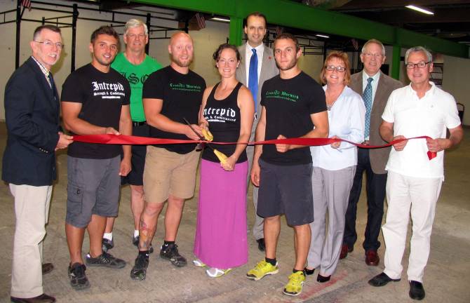 CrossFit Warwick reopens at new location Photo by Roger Gavan On Sept. 5, local officials and members of the Warwick Valley Chamber joined owners Ryan and Katie Hansen and their staff for the grand reopening of CrossFit Warwick in its new location at 77 Forester Ave. From left, Warwick Supervisor Michael Sweeton, CrossFit Warwick coach John Schamarek, Village Trustee and CrossFit Warwick coach Bill Lindberg, owners Ryan and Katie Hansen, Warwick Valley Chamber President Paul Rafanello, CrossFit Warwick coach Ben Chianehiano, Assemblywoman Annie Rabbittís chief of staff Marie Steets, Chamber Executive Director Michael Johndrow and Mayor Michael Newhard.