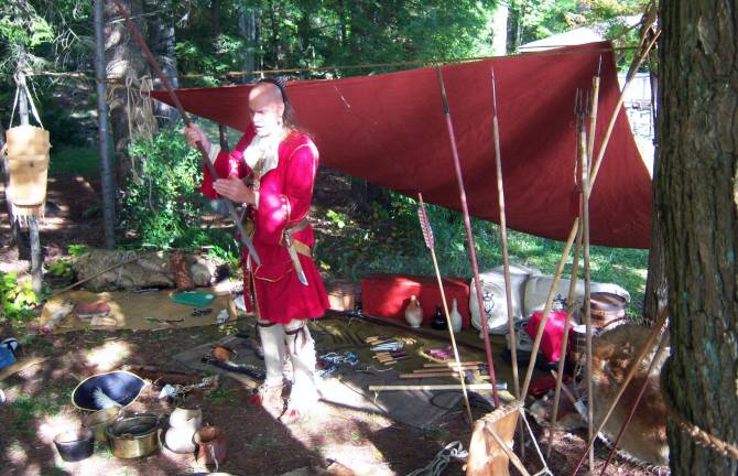 Warwick Historical Society hosts annual history camp in August Photo provided by the Warwick Historical Society A re-enactor at last year's history camp sponsored by the Warwick Historical Society explains aspects of the weaponry used by Native Americans.