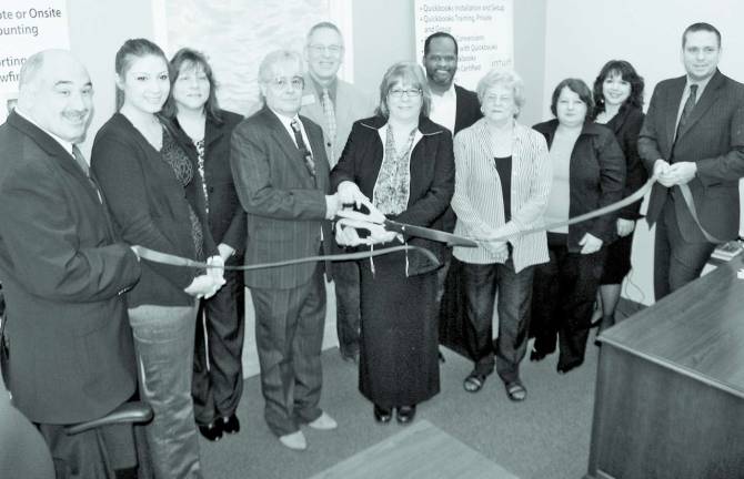 R&D Accounting and Business Management hosts ribbon-cutting ceremony Photo by Roger Gavan Last month, representatives from the Towns of Chester and Warwick and the business community joined owner Rochelle DeJong and her staff for the official grand opening of R&D Accounting and Business Management. Flanked by Warwick Deputy Supervisor Jim Gerstner (far left) and Town of Chester Supervisor Steven Neuhaus (far right) Rochelle DeJong and her fiancÈe William Schneider cut the ribbon to officially open the office of R&D Accounting and Business Management.