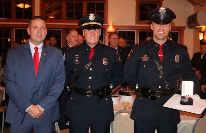 County hosts inaugural Meritorious Service Awards reception Provided photo Orange County Executive Steven M. Neuhaus, left, with Village of Goshen Police Chief James Watt and Officer Brian Kelly, who helped save the lives of an elderly couple before their car burst into flames on Route 17 East in Goshen.